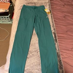 New scrubs with tags. Shirt, bottoms and jacket.